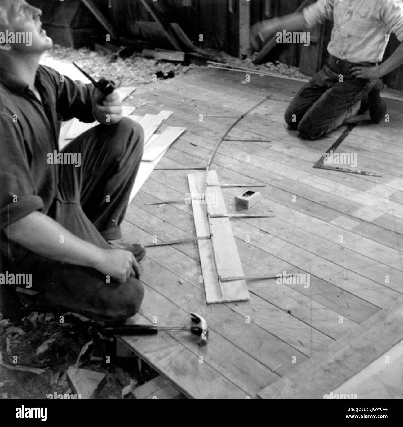 Written on Blowing Paper: The spant form is transferred from Traekstok to template board. Photographed by: Ole Crumlin-Pedersen photo is taken: 1964-08-05 Stock Photo
