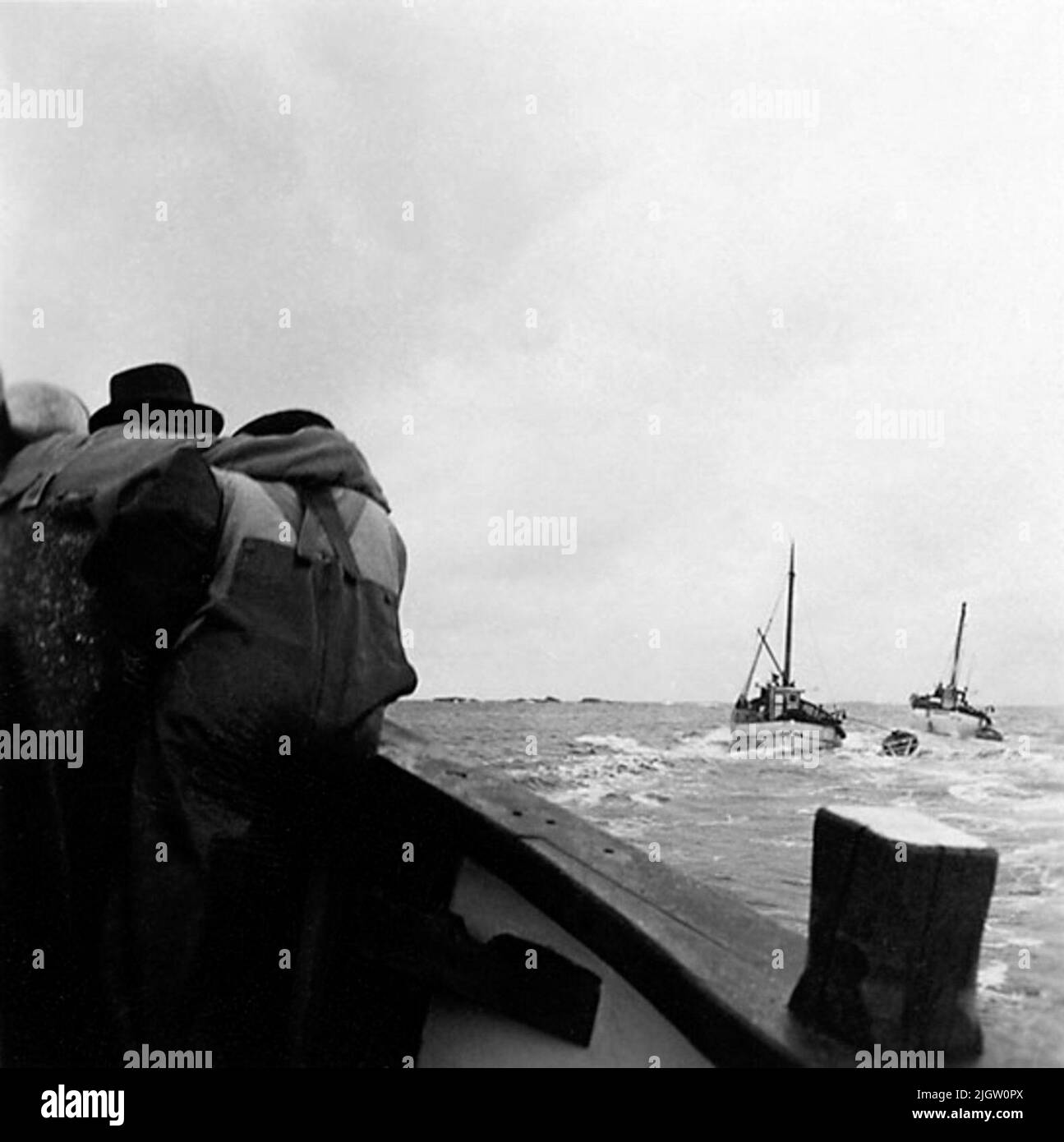Two visible fishing boats Black and White Stock Photos & Images - Alamy