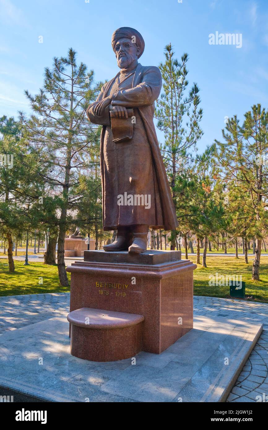 A bronze statue of a standing Behbudiy, famous writer. At Alisher Navoi ...