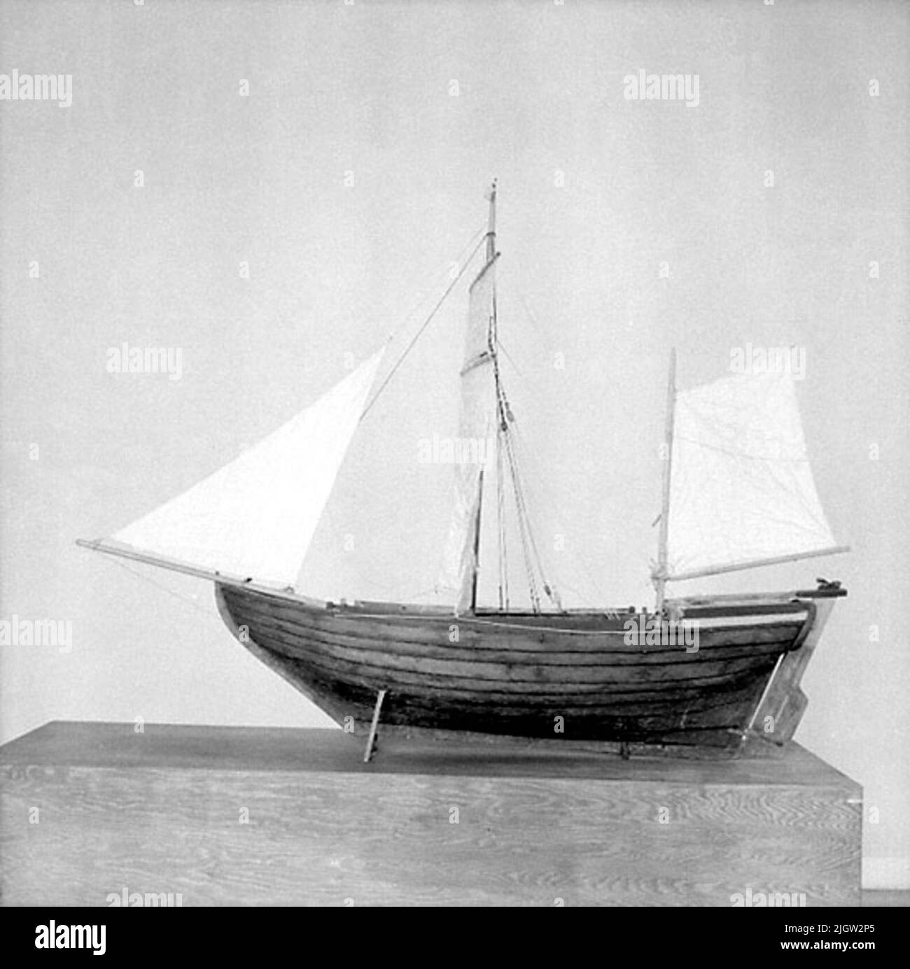 A model of a boat with set sails Stock Photo Alamy