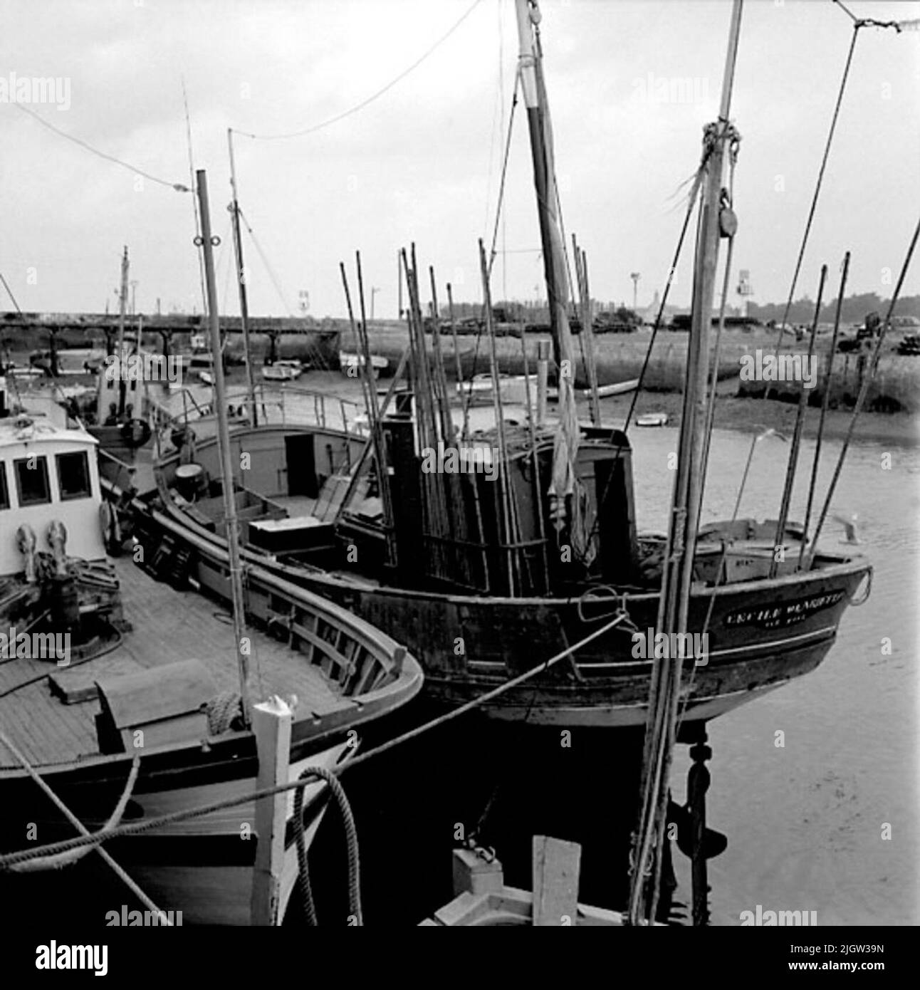 10. France. Photo journal is available at B.M.A. + Photo albums. Acquisition: Books and archive materials. Photos taken 1959-10-17.12 Pictures in series. According to notes: France. Atlantic coast, Le Croisic, 17/10-59. Boats of different types. Most common and oldest? Seems the boats with aft mirror to be, but boats with hedges or cruise only also occur. The latter appear to have first gained entry among the trawls, while the smaller boats are still clearly dominated by the stern type. A number of boats are in a port. Stock Photo