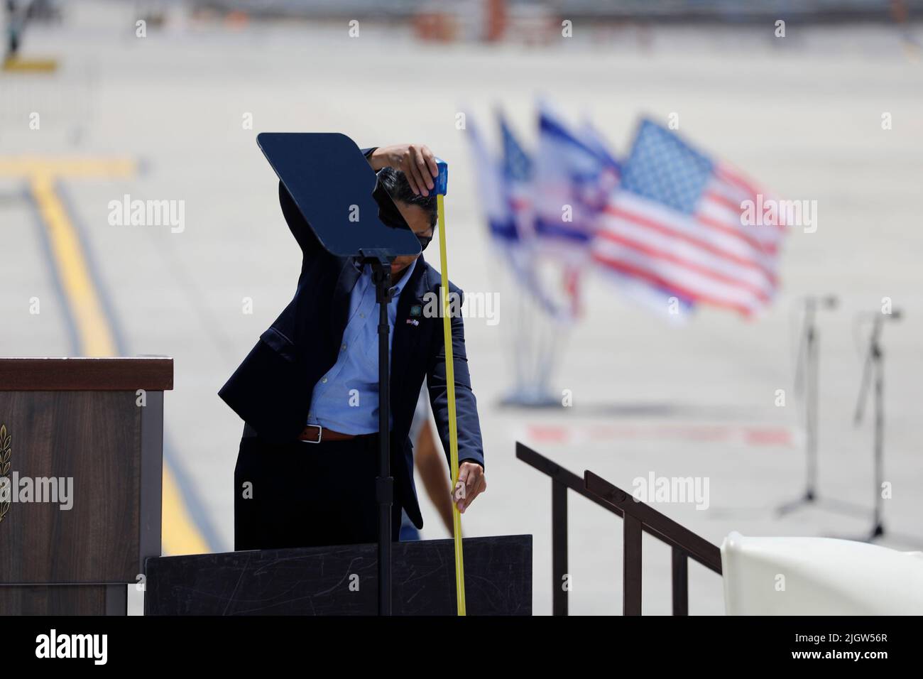 Lod, Israel. 13th July, 2022. White House staff check the podium at Ben Gurion airport ahead of the arrival of US President Joe Biden for the state visit to Israel. Credit: Ilia Yefimovich/dpa/Alamy Live News Stock Photo