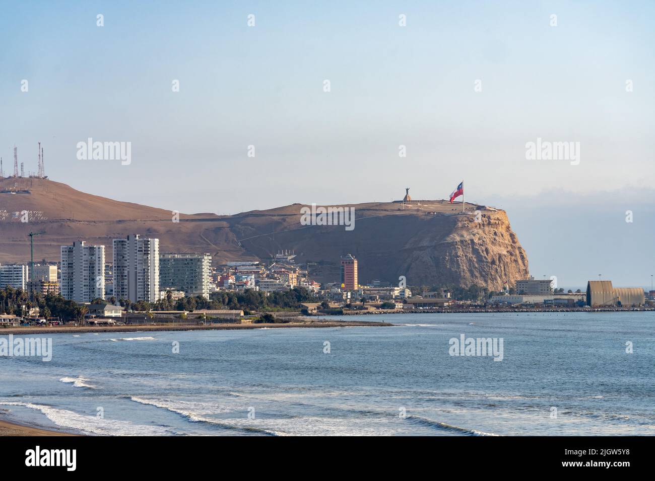 El Morro hill with its giant Chilean flag overlooks the Pacific Oean and the city of Arica, Chile. Stock Photo