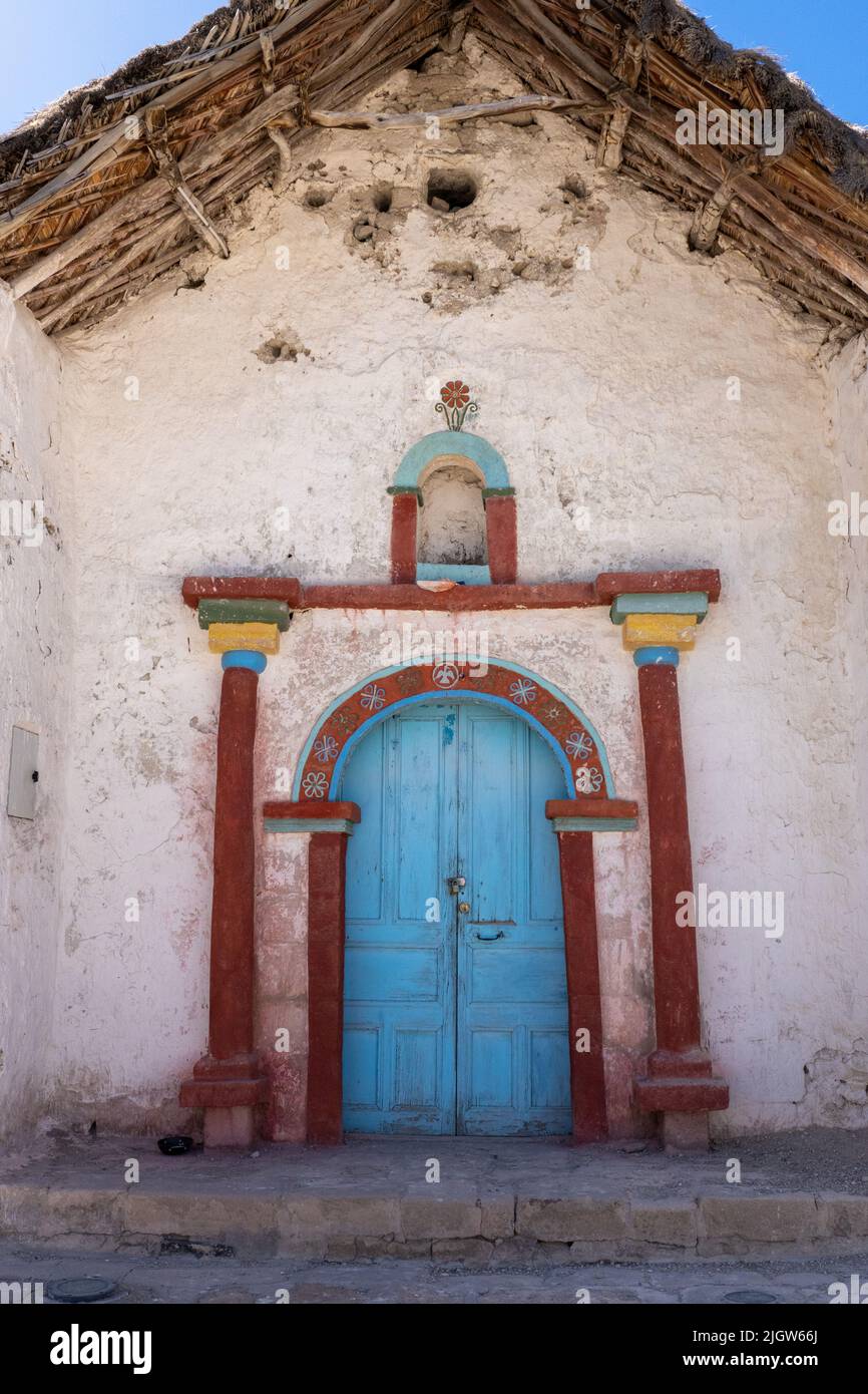 Facade of the Church of the Virgin of the Nativity in Parinacota on the Andean altiplano in Lauca National Park in Chile. Stock Photo