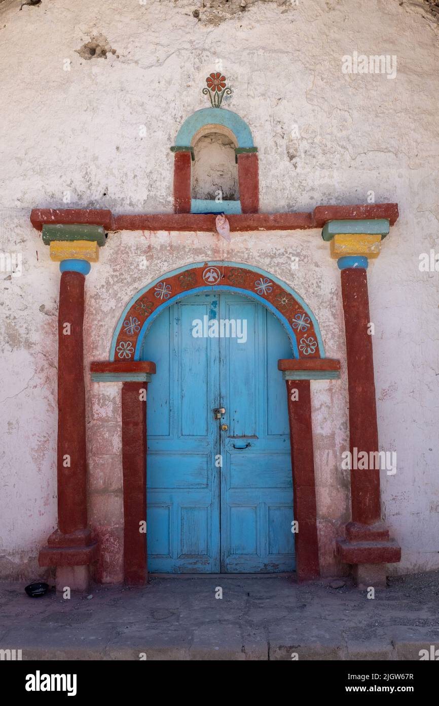 Painted doorway of the Church of the Virgin of the Nativity in Parinacota on the Andean altiplano in Lauca National Park in Chile. Stock Photo