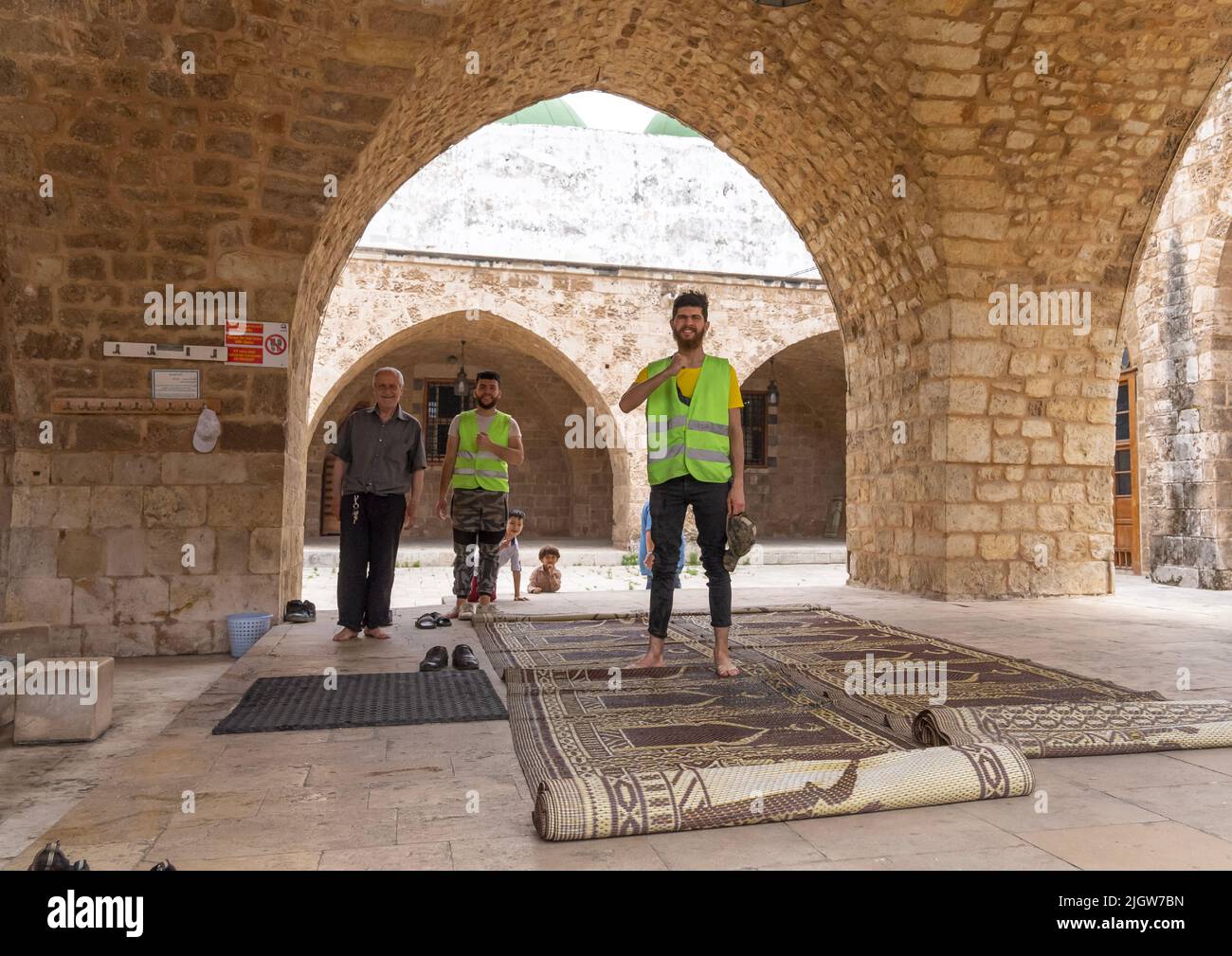 Men in Al Mansouri Al Kabir mosque, North Governorate, Tripoli, Lebanon Stock Photo