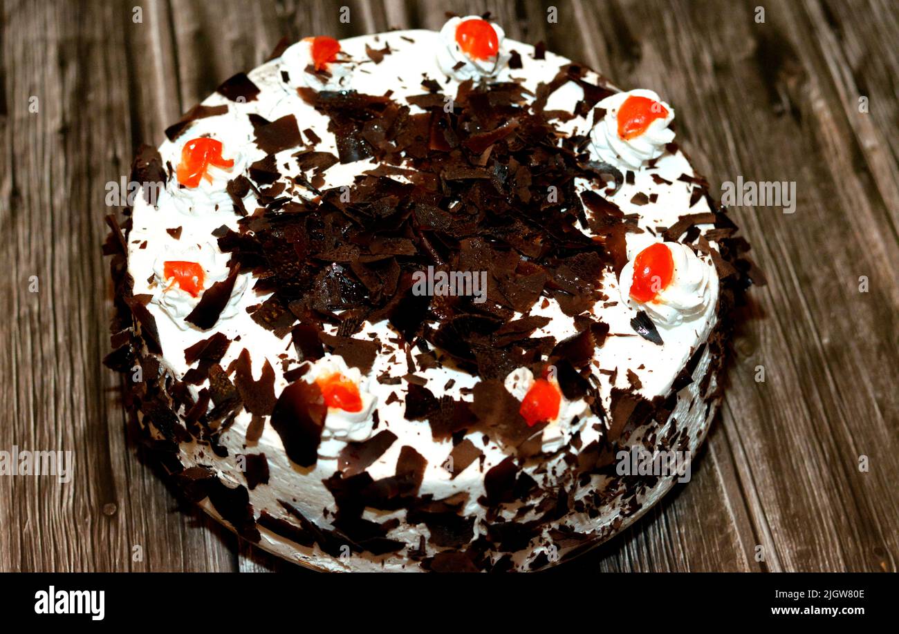 A black forest cake, a light chocolate sponge cake, soaked with cherry