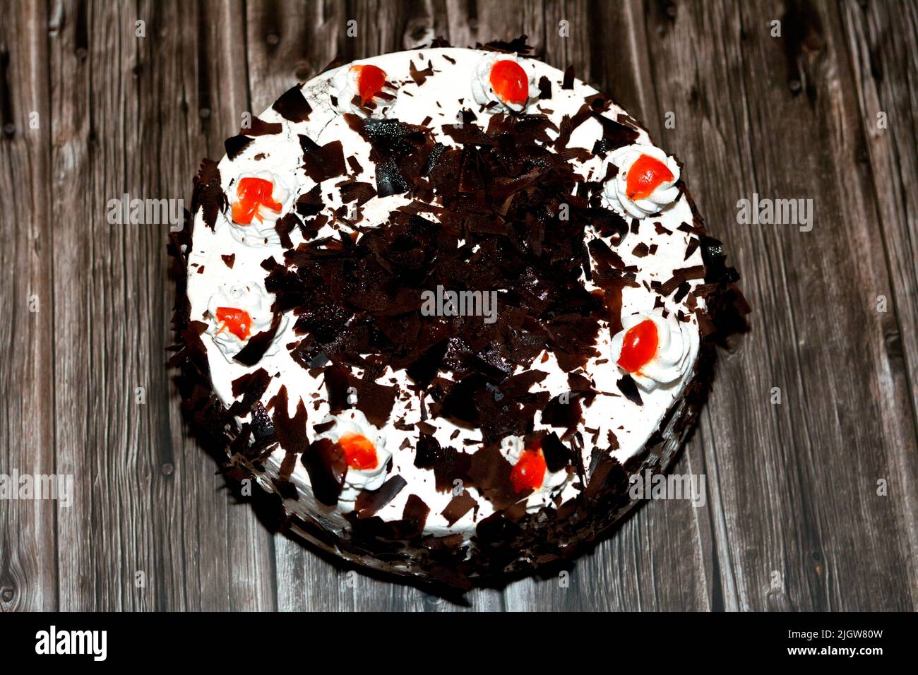 A black forest cake, a light chocolate sponge cake, soaked with cherry