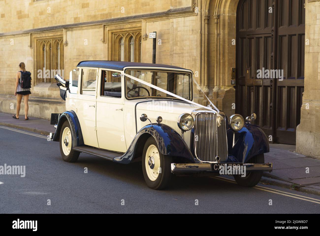 An Armstrong Siddeley vintage wedding car (year I936) sits outside of Jesus College Chapel on Turl Street, Oxford Stock Photo