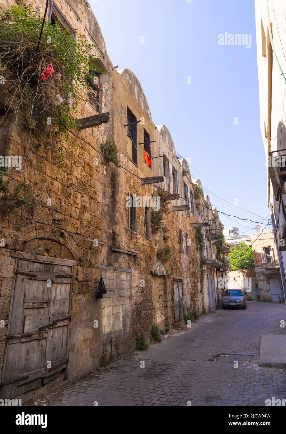 Old caravanserai occupied by poor people, North Governorate, Tripoli, Lebanon Stock Photo