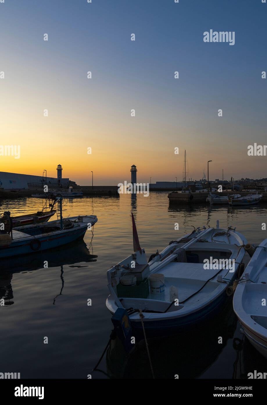 Fishing boats in the harbor in the sunset, North Governorate, Batroun, Lebanon Stock Photo