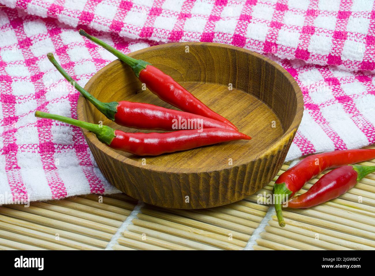 Closeup red pepper on the wooden bowl, chilis are hot and spicy Stock Photo