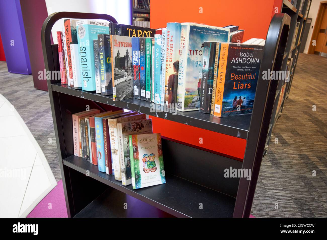 returned books to be sorted and catalogued on trolley in Liverpool Central Library merseyside england uk Stock Photo