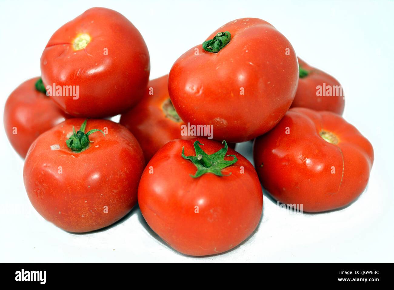 Pile of fresh red tomatoes vegetables isolated on white background ...