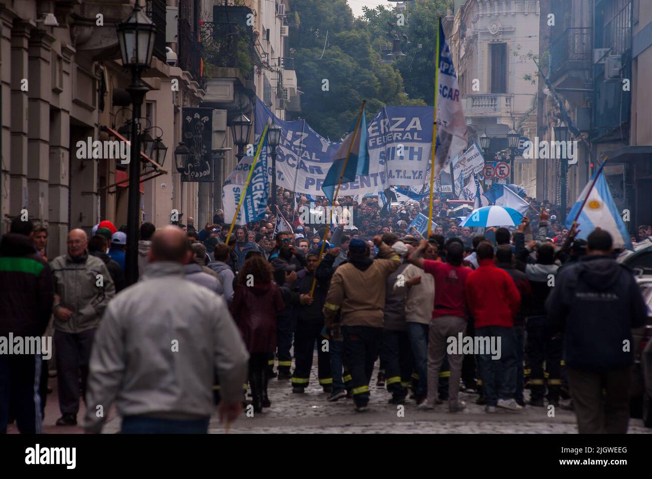 The Hispanic demonstrators with posters walking during the Workers' Day Rally in Buenos Aires, Argentina Stock Photo