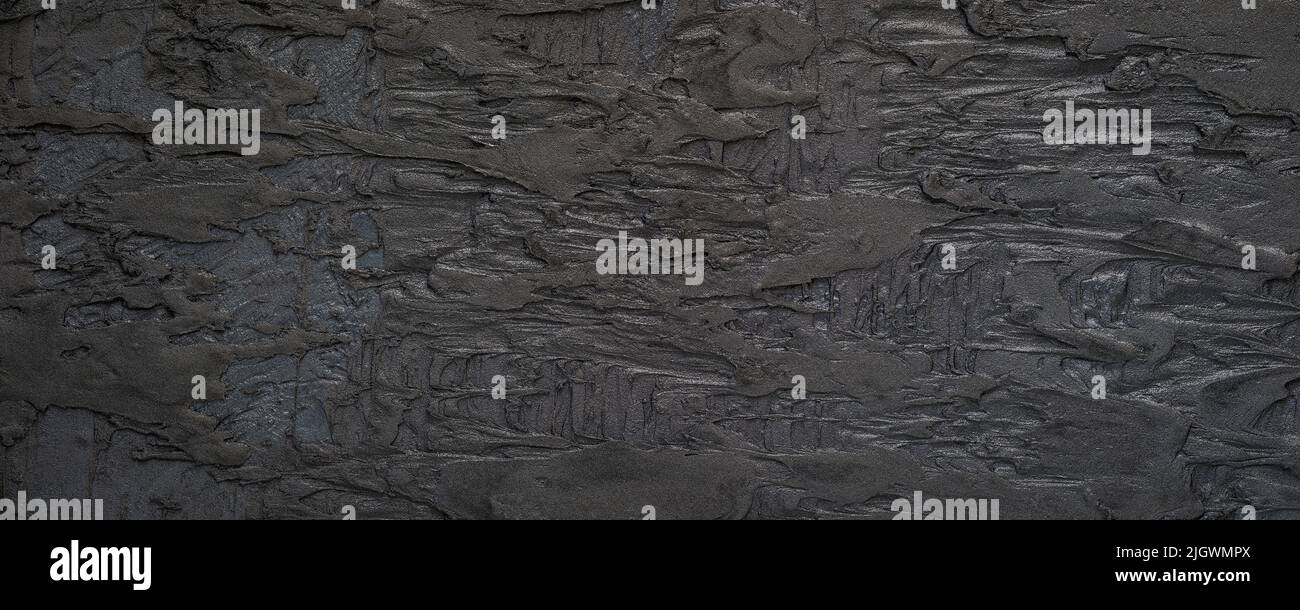 Black or dark gray grainy plaster texture background Stock Photo