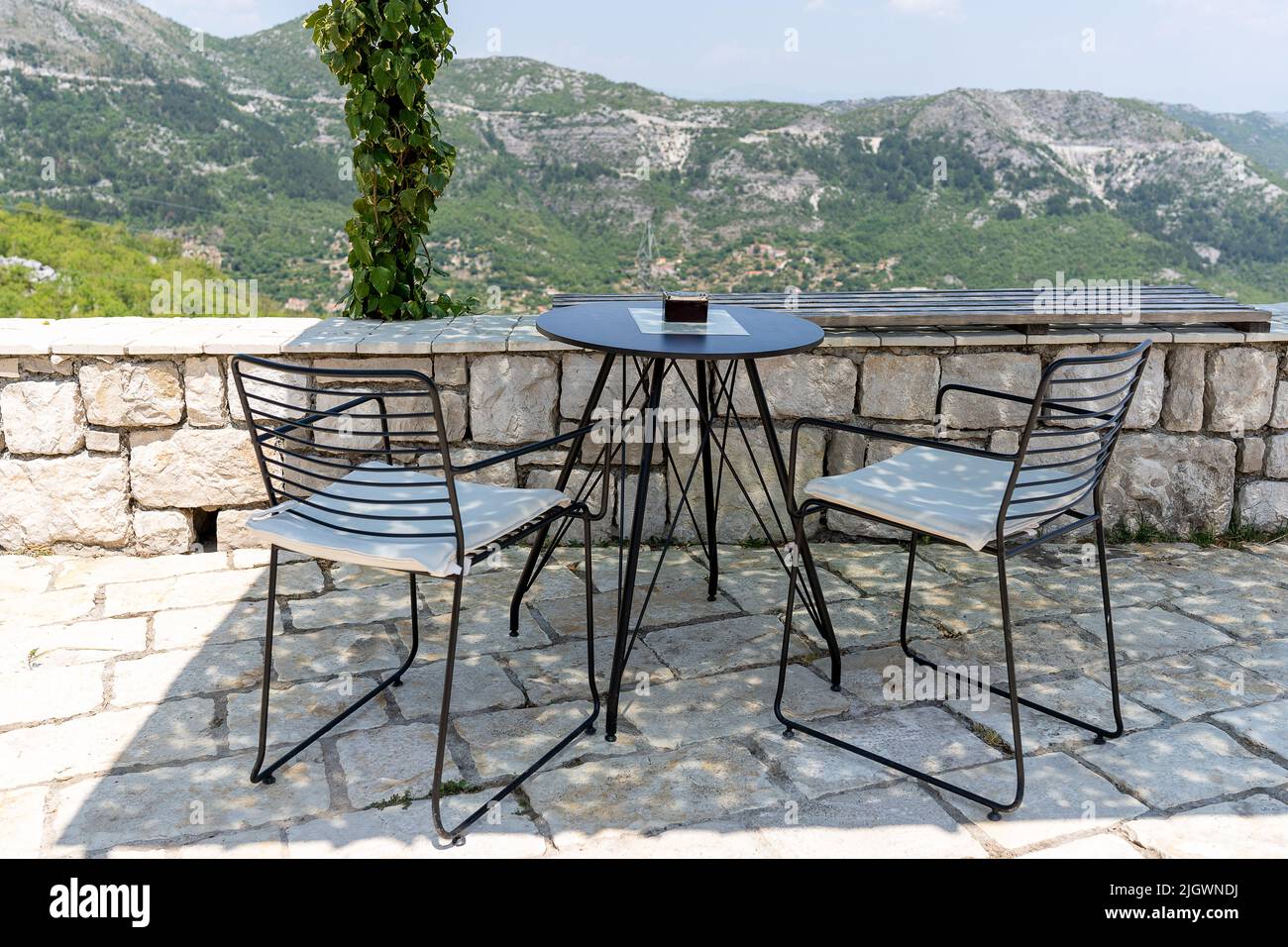 Chairs and table in the viewpoint under pergola Stock Photo Alamy