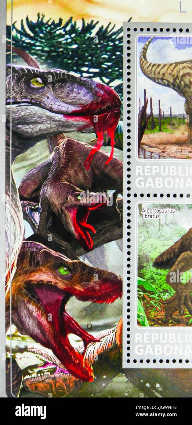 MOSCOW, RUSSIA - JUNE 17, 2022: Postage stamp printed in Gabon shows Repteles eating, Dinosaurs serie, circa 2017 Stock Photo