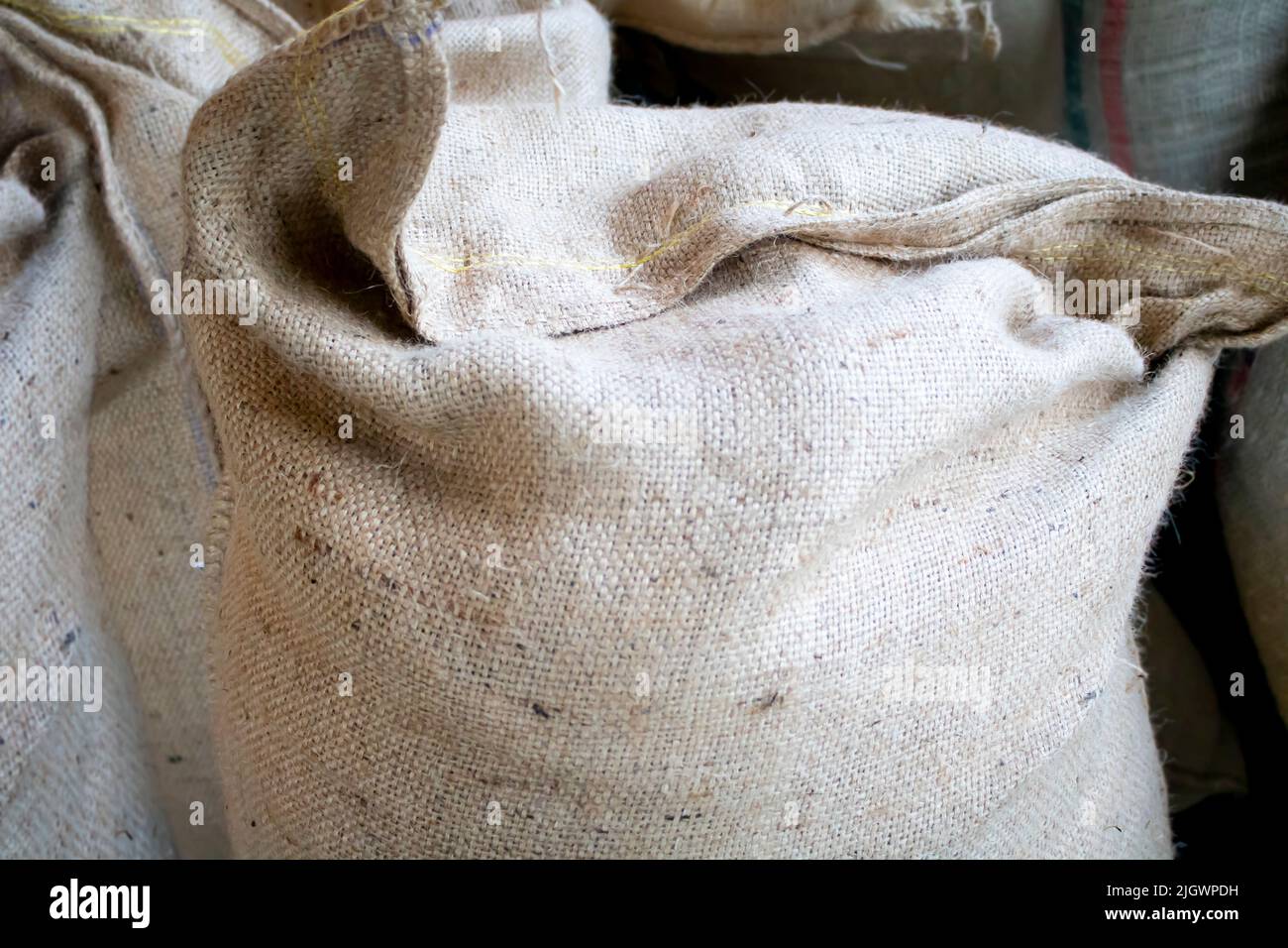 burlap of large quantities of products shipped to a retail reseller Stock Photo
