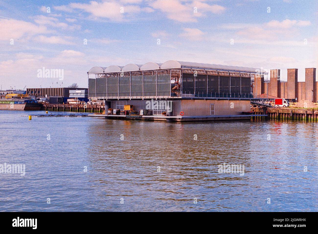 Rotterdam, Netherlands. The innovative, agricultural project: 'Floating Farm', produces diary and milk products on a structure, floating in de middle of an harbor. Stock Photo