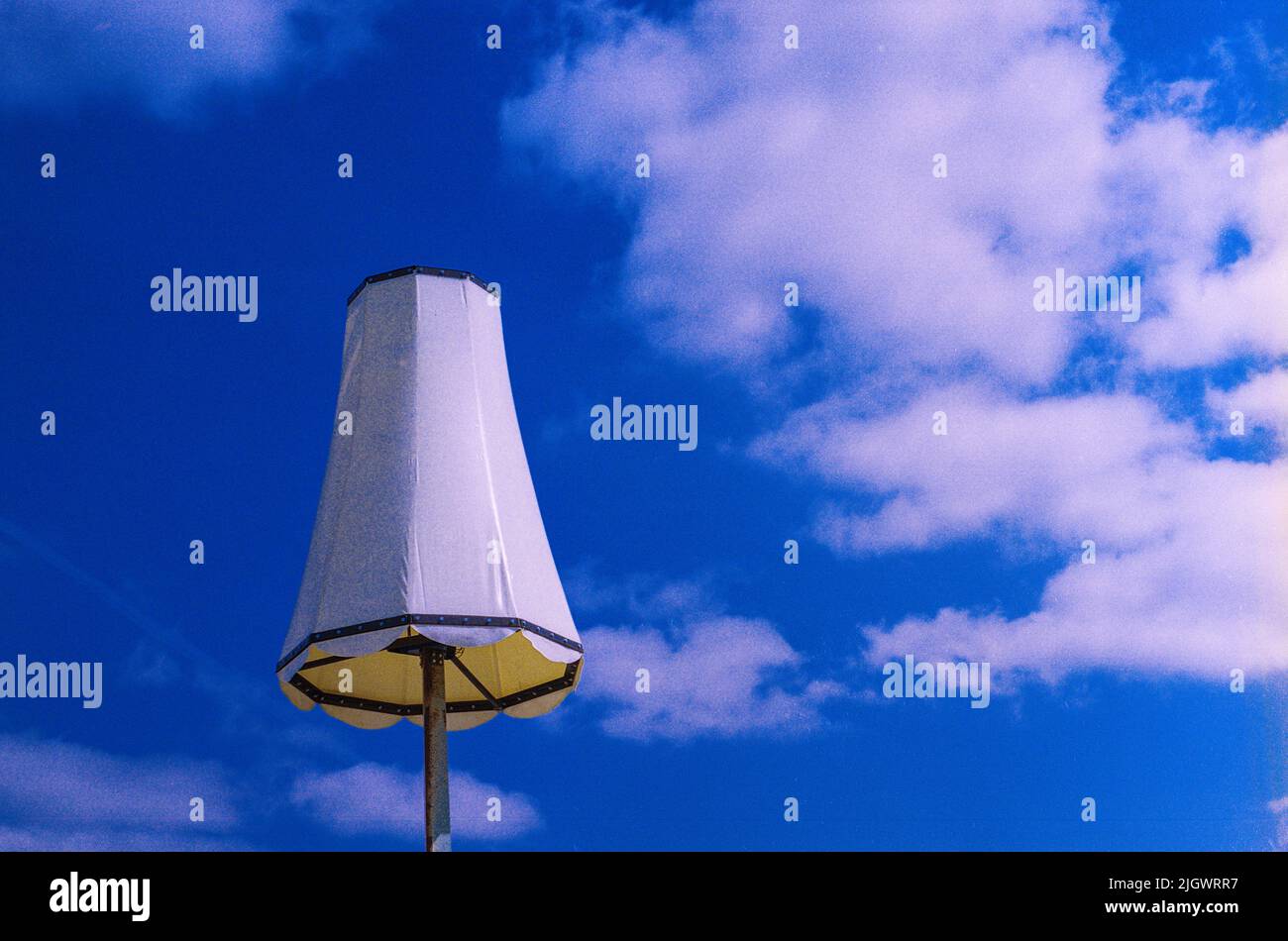 Rotterdam, Netherlands. Lampshade on a Pole against a Blue Sky. An Industrial Piece of Art and Landmark inside Port of Rotterdam Harbour. Stock Photo