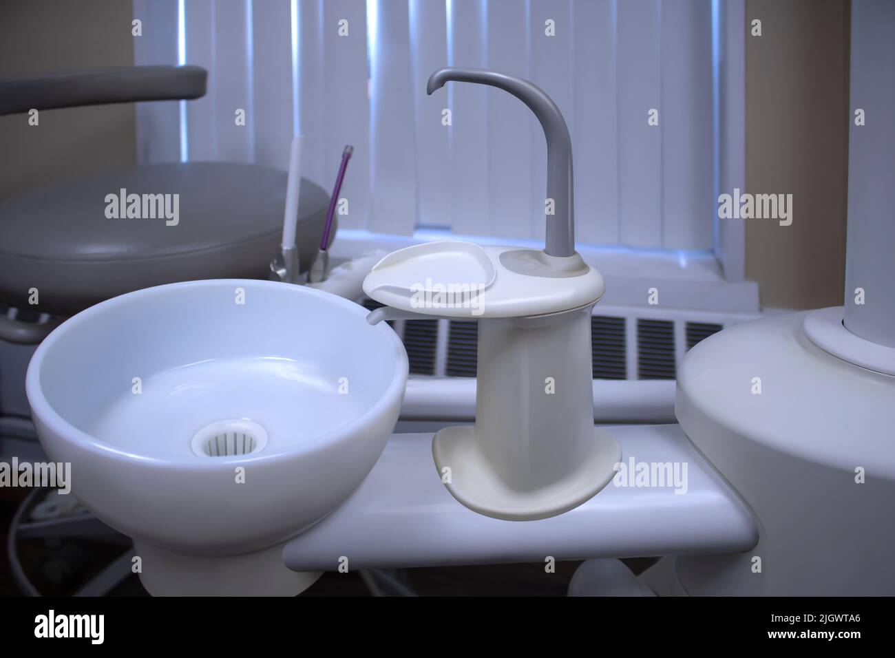 dentist's patient chair with rinsing station Sink for Medical equipment Stock Photo