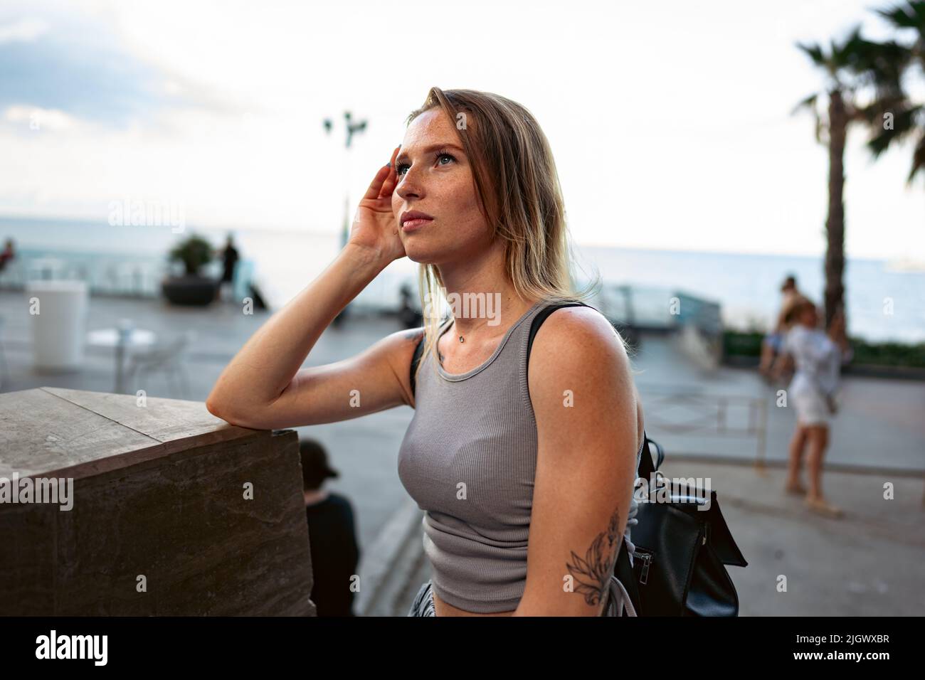 Portrait of a young beautiful woman in the summer city Stock Photo - Alamy