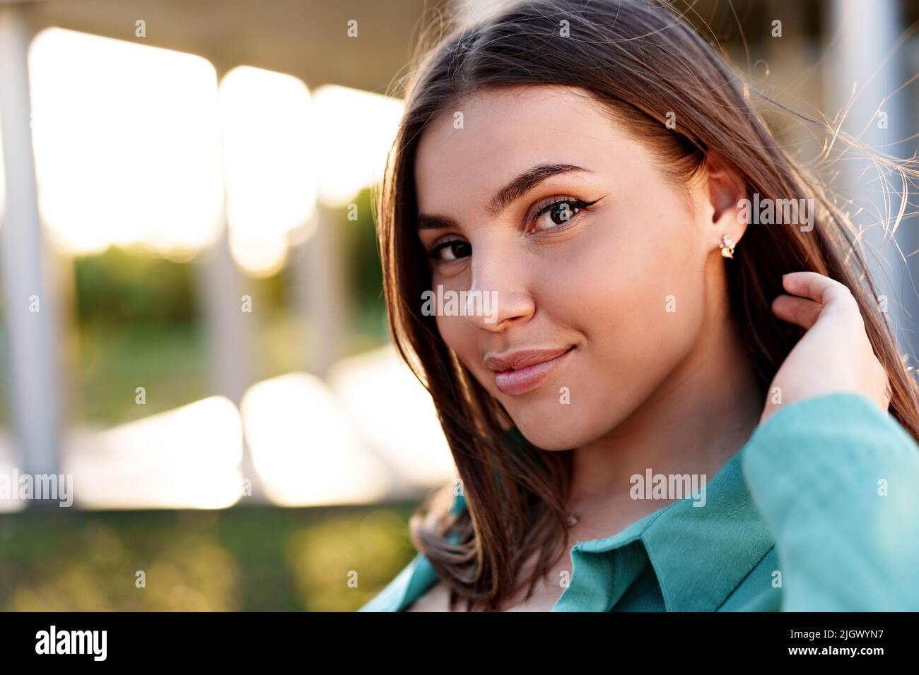 Close up portrait of a young smiling brunette woman Stock Photo - Alamy