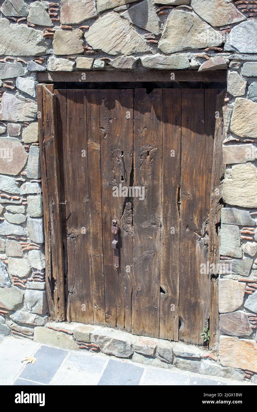 The wooden door in Cyprus is not rich but authentic, with charm and the smallest castle in the western part of the island Next to the Aphrodite pond Stock Photo