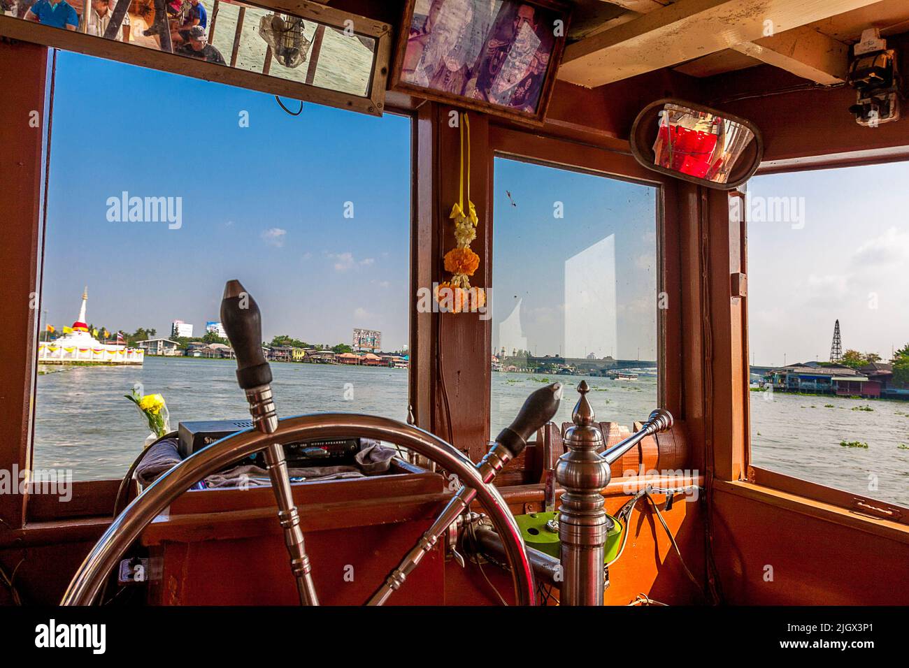 Wheel House on a boat with a view of the river in Bangkok Stock Photo