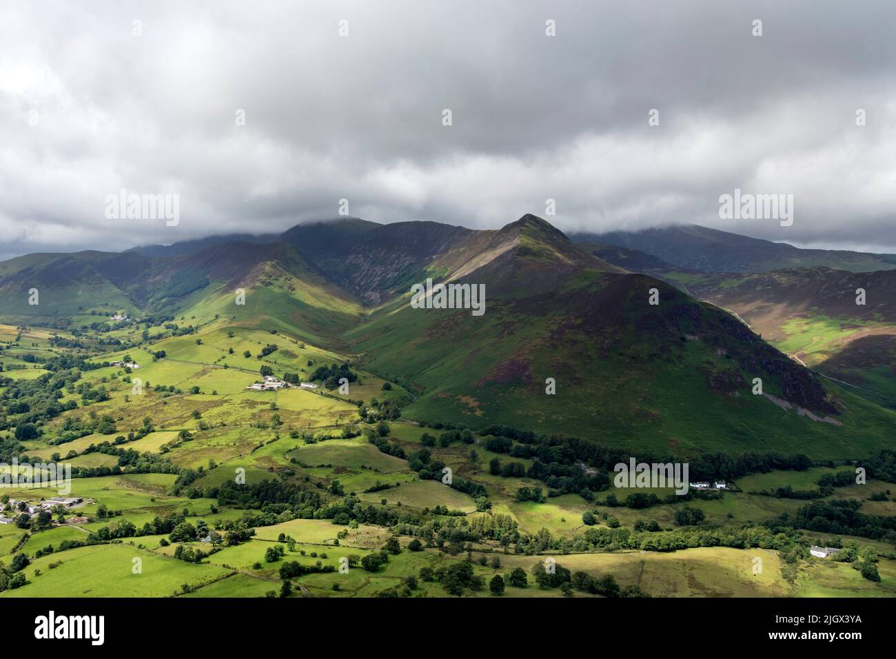 The view over a sunlit Newlands valley towards Causey Pike, Scar Crags, Crag Hill and Ard Crags from the summit of Cat Bells, Lake District, Cumbria, Stock Photo