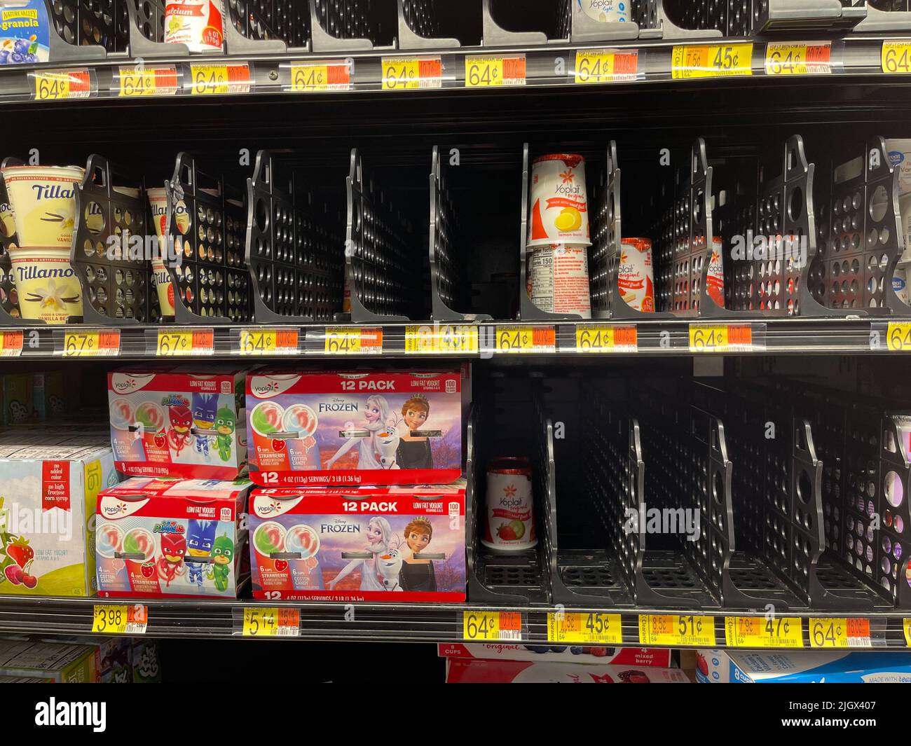 Empty dairy shelves at grocery store. Supply chain disruption.  Stock Photo