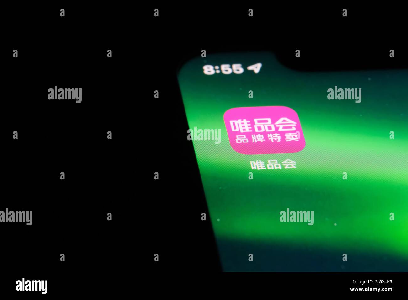 Shanghai,China-Feb. 19th 2022: close up Vipshop mobile app icon on phone screen. Vipshop is a Chinese company that operates the e-commerce website VIP Stock Photo