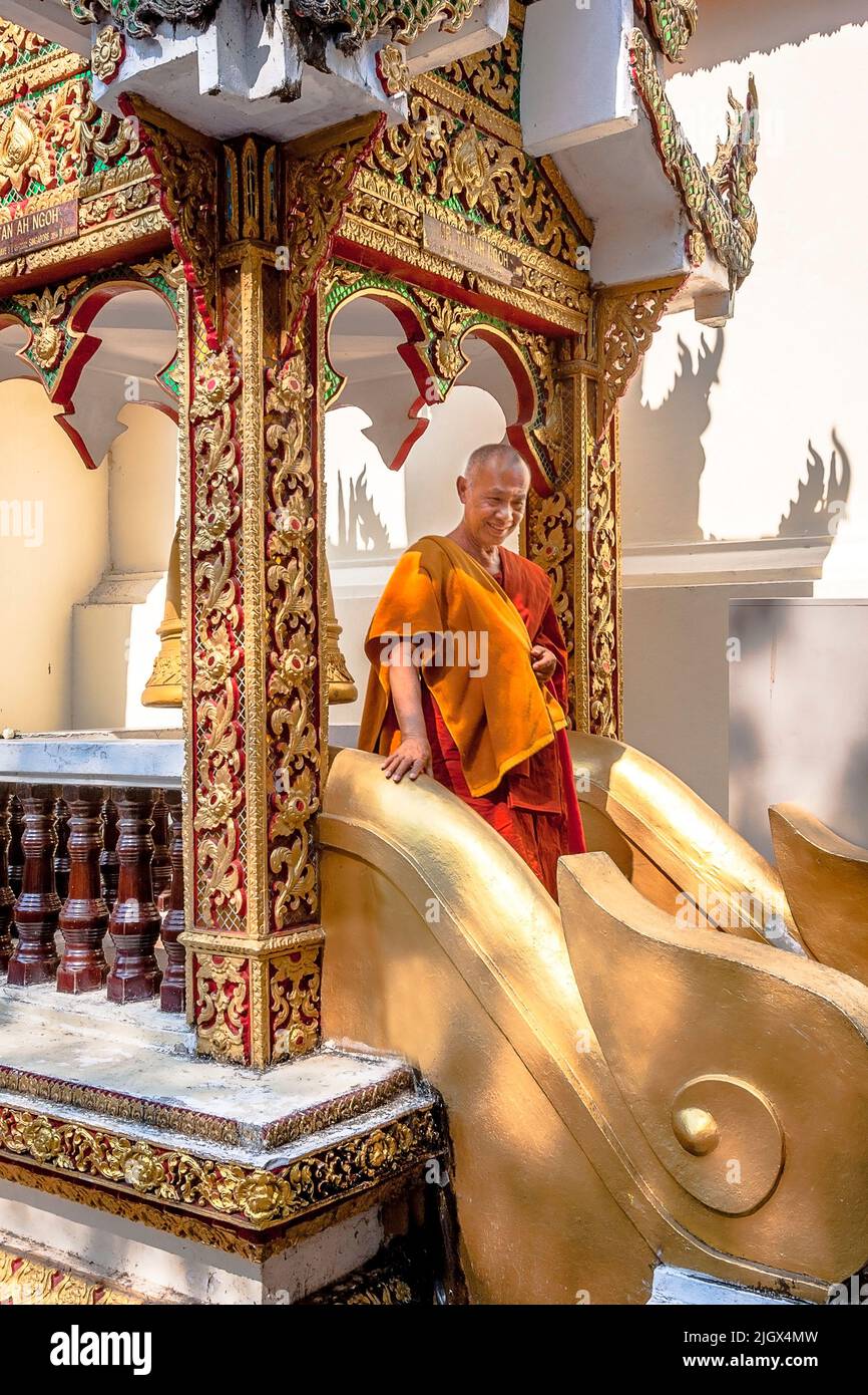 Monk decending down the temple stairway. Stock Photo
