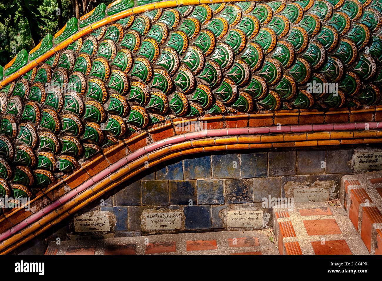 Details on the dragon stairway railing showing the engraved bricks on ...