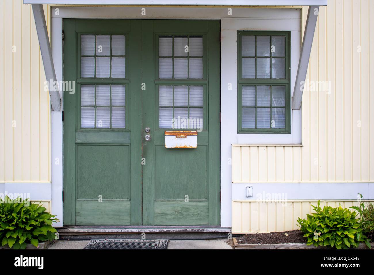Green two door entry in a house Stock Photo