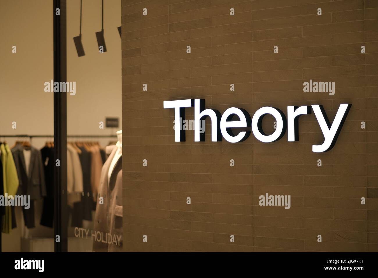 Shanghai,ChinaDec.12th 2021 close up Theory logo in clothing store