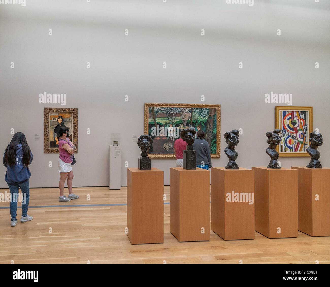 Los Angeles, CA, USA – July9, 2022: A visitor looks at paintings in the modern art wing of LACMA in Los Angeles, CA. Stock Photo