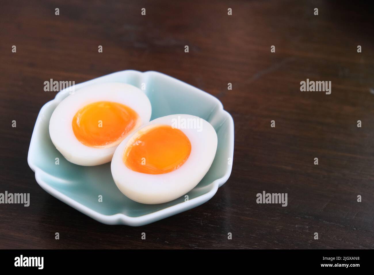 close up a dish of soft boiled egg on table. Stock Photo