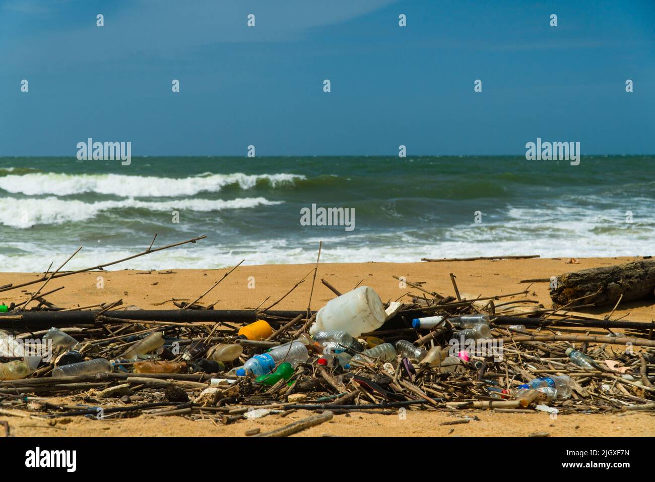 Plastic and wood waste on the beach pollute the environment. Negombo