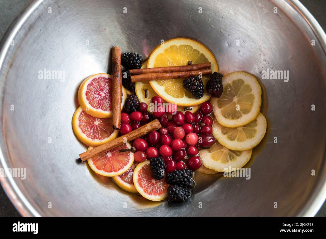 Overhead view of ingredients for fall cocktails in mixing bowl Stock Photo
