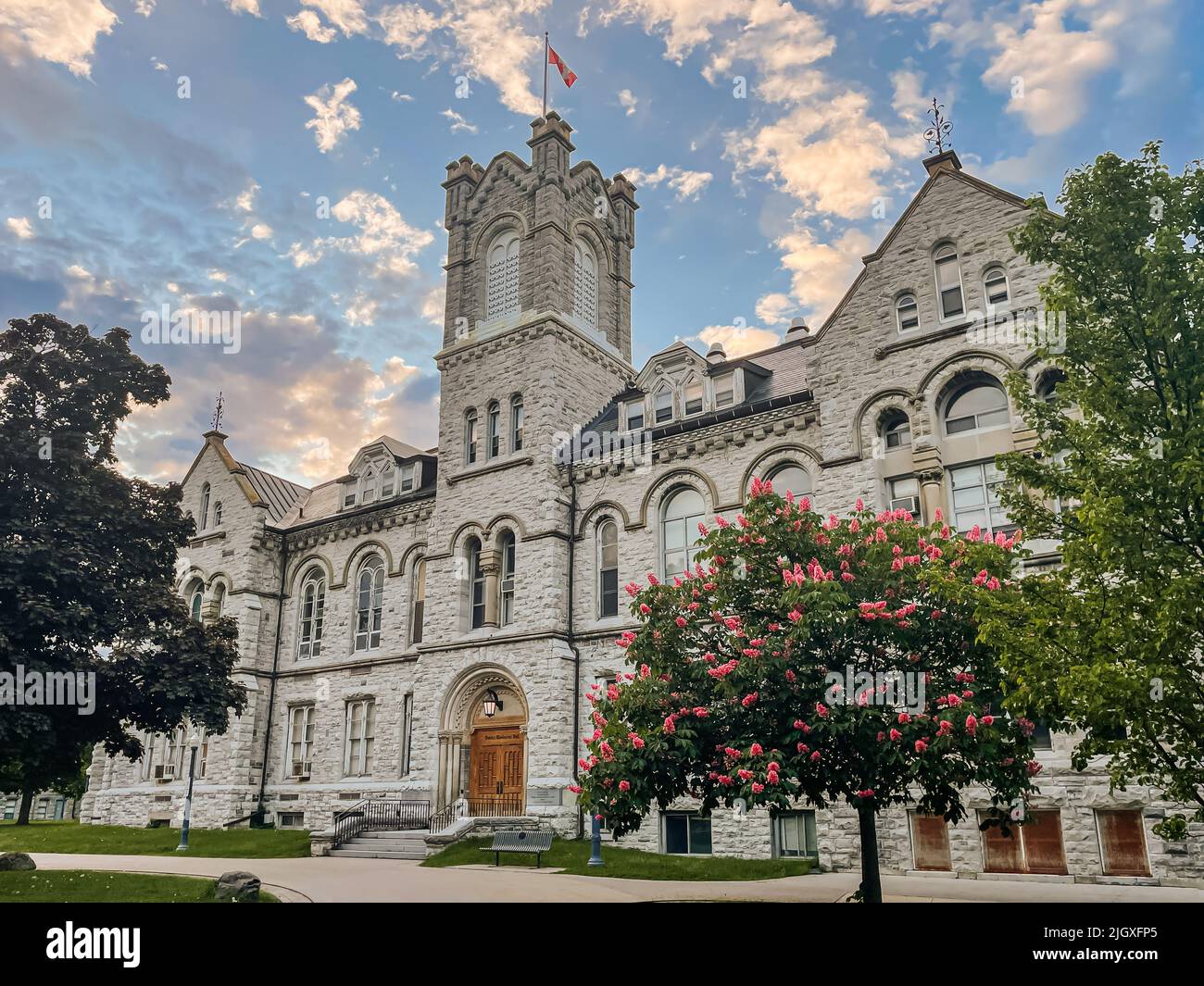 Stone building on Queen's University campus on a summer day. Stock Photo