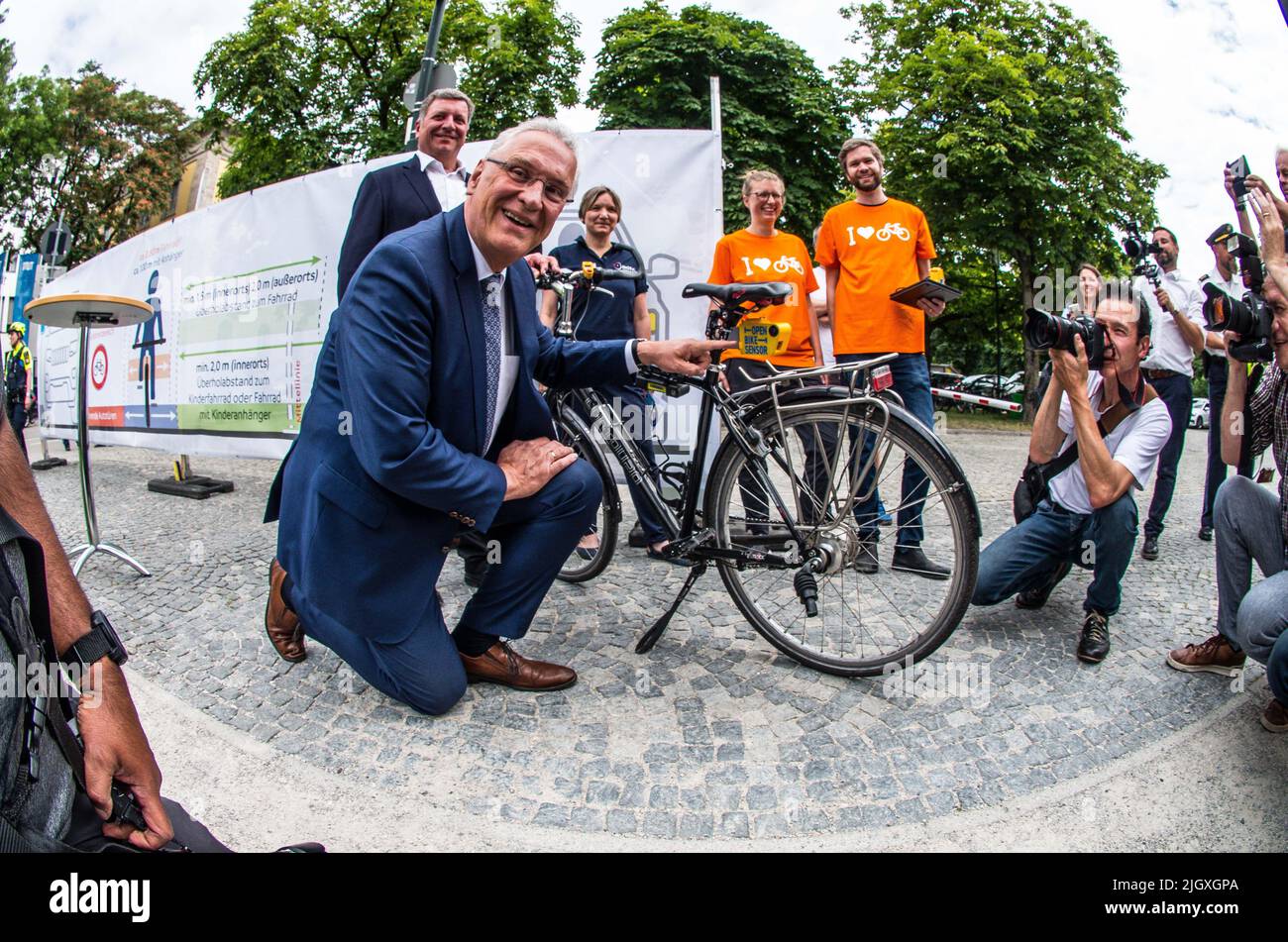 Munich, Bavaria, Germany. 13th July, 2022. The State of Bavaria, the ADAC (Auto Club), and ADFC (German Bicyclist Club) interest group presented an initiative to enhance rider safety in Bavaria with a particular focus on informing motorists of the required 1.5m distance from cyclists in inner cities and 2.0m outside. The ADFC presented a bike specially equipped with sensors that measure the distance to passing cars. In attendance were Christian Bernreiter, the transportation minister of Bavaria, as well as interior minister Joachim Herrmann. (Credit Image: © Sachelle Babbar/ZUMA Press Wire) Stock Photo