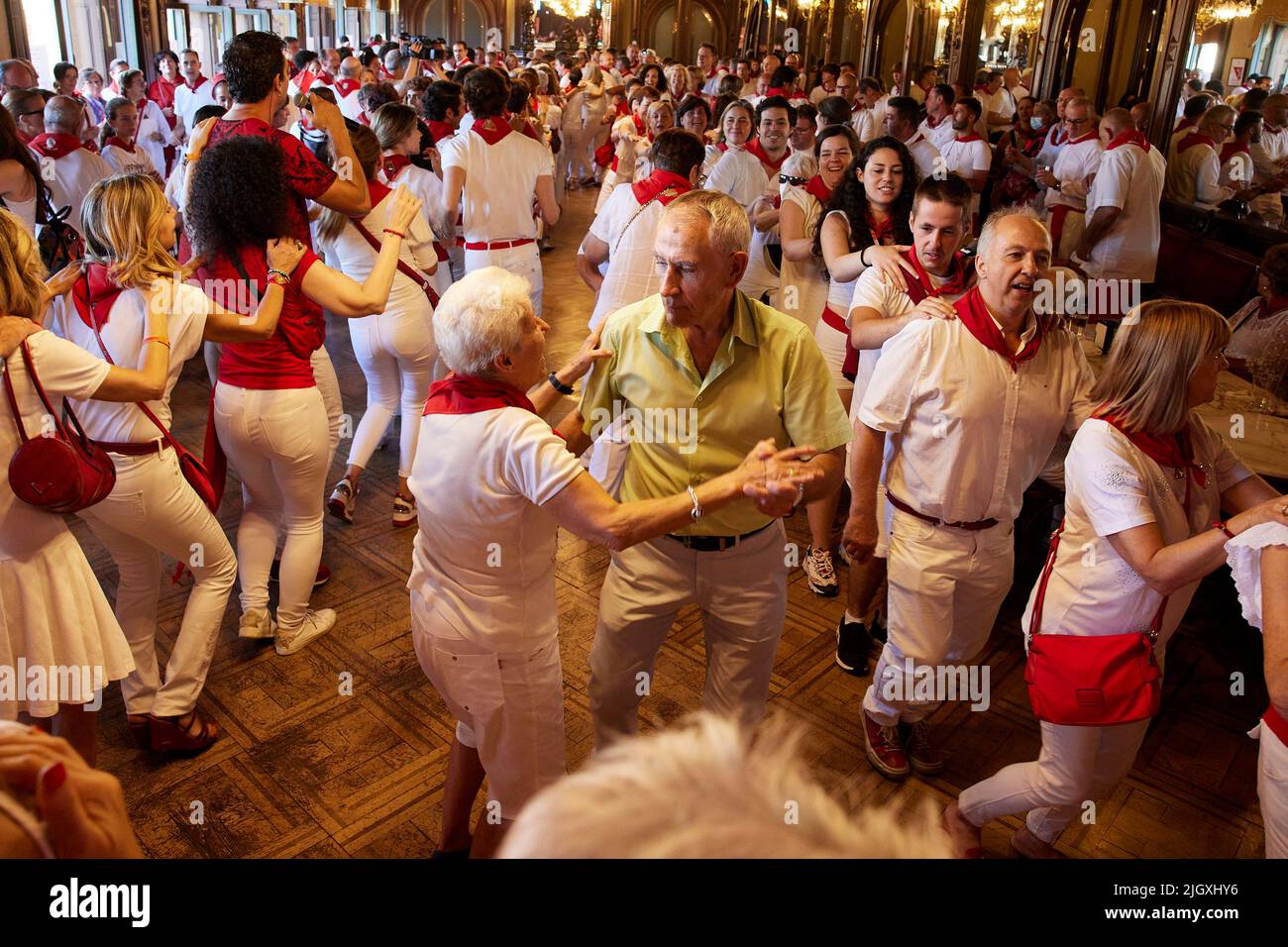Pamplona, Navarre, Spain. 13th July, 2022. Revellers dance at the Casino during the 'Baile de la Alpargata' (Espadrille dance) on the seventh day of the San Fermin Running of the Bulls festival on July 13, 2022 in Pamplona, Spain. The annual Fiesta de San Fermin, made famous by the 1926 novel of US writer Ernest Hemmingway entitled 'The Sun Also Rises', involves the daily running of the bulls through the historic heart of Pamplona to the bull ring. (Credit Image: © Ruben Albarran/ZUMA Press Wire) Stock Photo