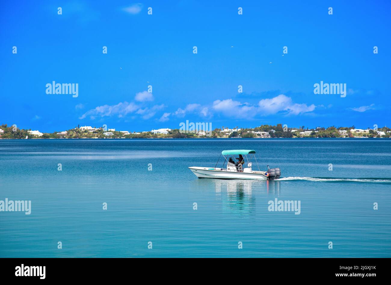 Boat travelling at speed in Harrington Sound, Bermuda. Stock Photo