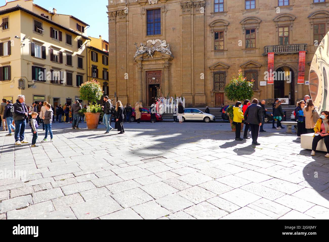 Priests and other robed, religious persons, gather for a Palm Sunday procession during Lent on the Piazza di San Firenze, Florence, Italy. Stock Photo