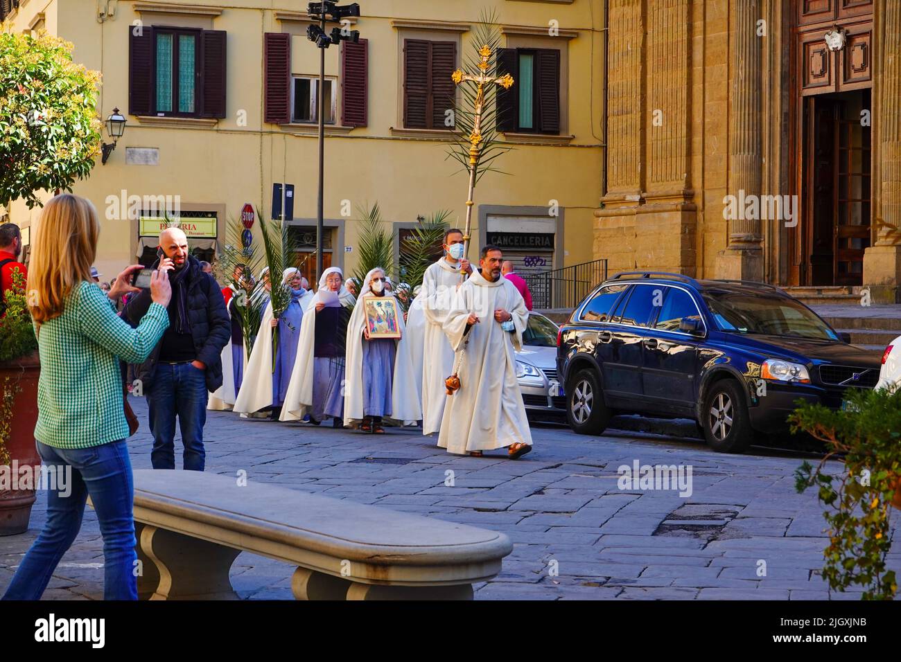 Palm Sunday procession during Lent with priests, nuns, and other robed religious persons, Piazza di San Firenze, Florence, Italy. Stock Photo