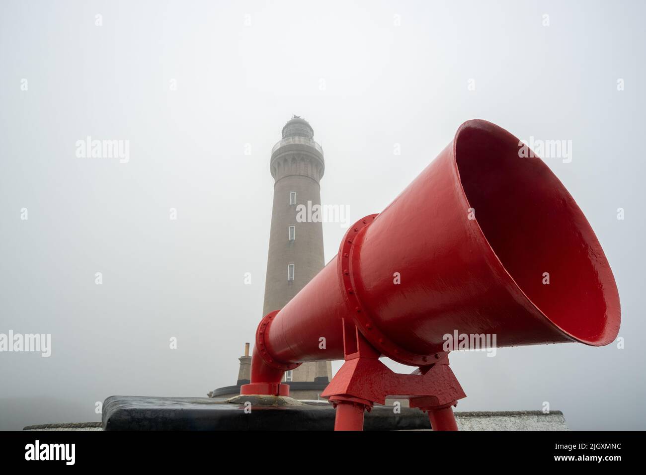 Ardnamurchan lighthouse and red foghorn on a foggy day, Scotland, UK Stock Photo