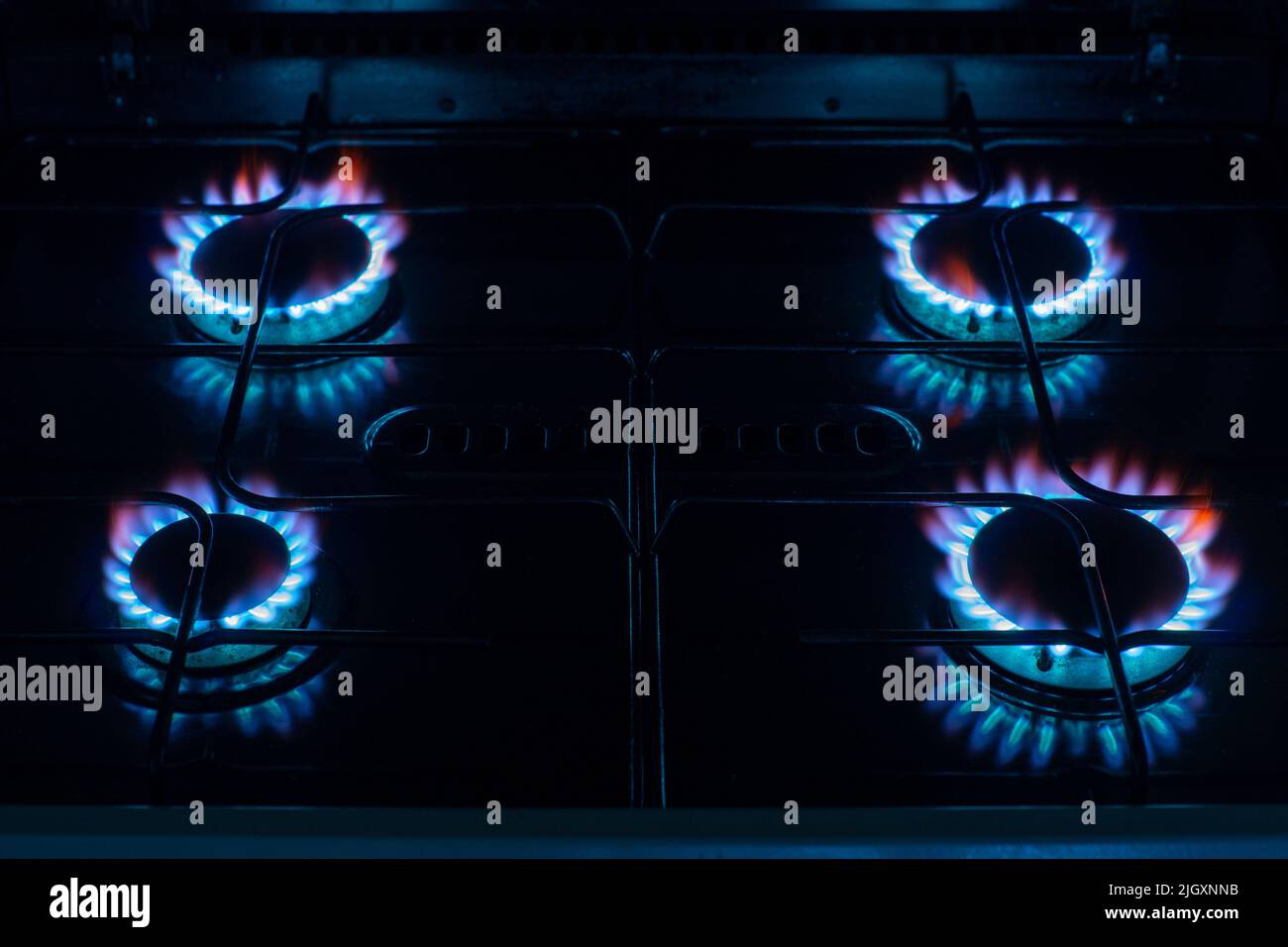 Gas Hob rings or burner with blue flame emissions. Concepts of energy