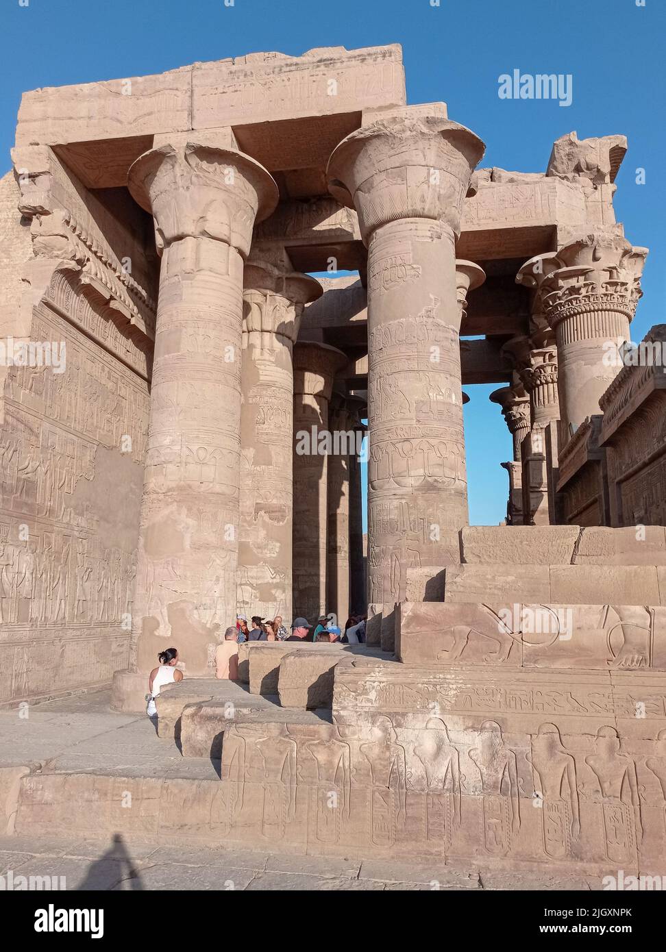 Ruins of an ancient egyptian temple with columns full of hieroglyphs in ...